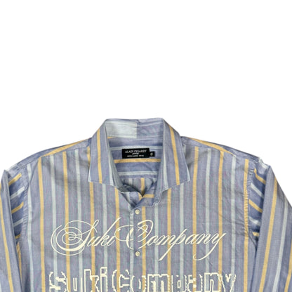 CAMISA MANGA LARGA SUKI AZUL RAYAS AMARILLAS LETRAS BLANCAS TALLA L SK214