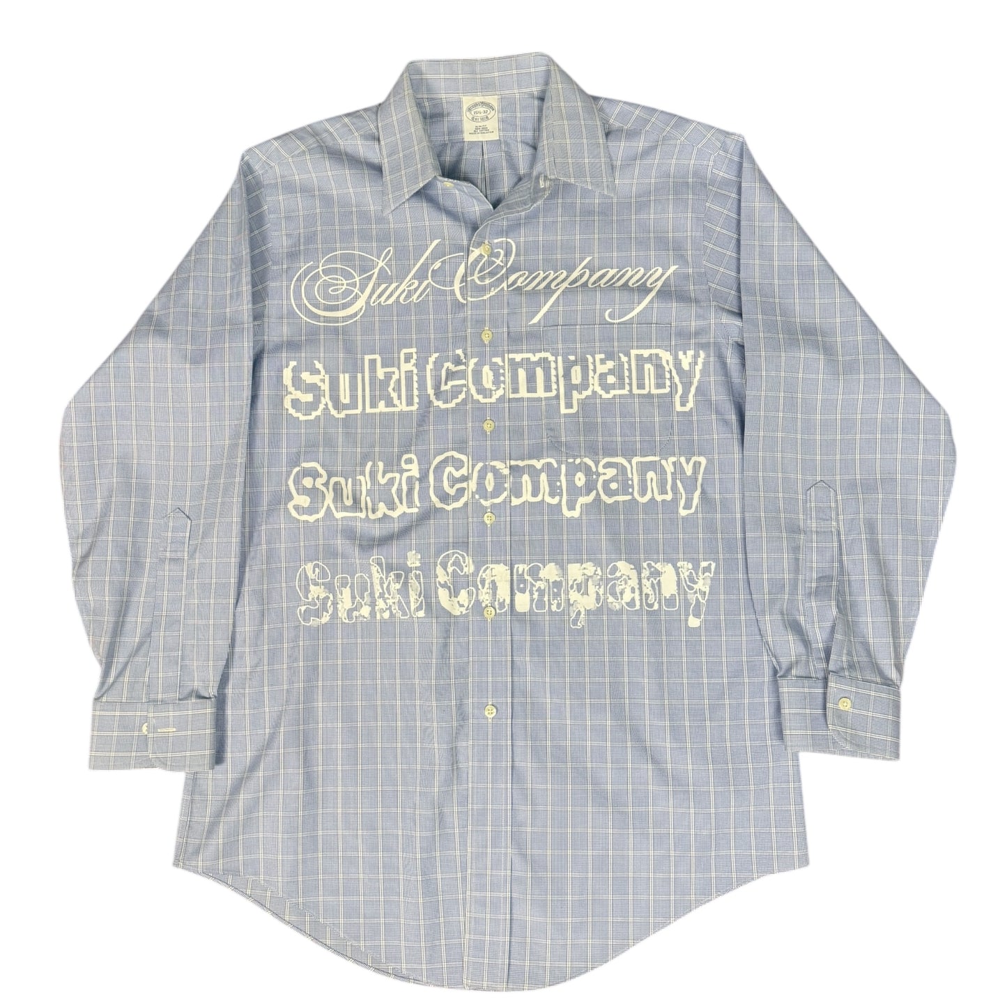 CAMISA MANGA LARGA SUKI AZUL CLARO CUADROS LETRAS BLANCAS TALLA L SK217