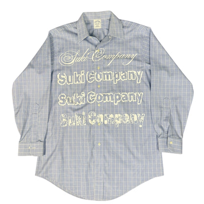 CAMISA MANGA LARGA SUKI AZUL CLARO CUADROS LETRAS BLANCAS TALLA L SK217
