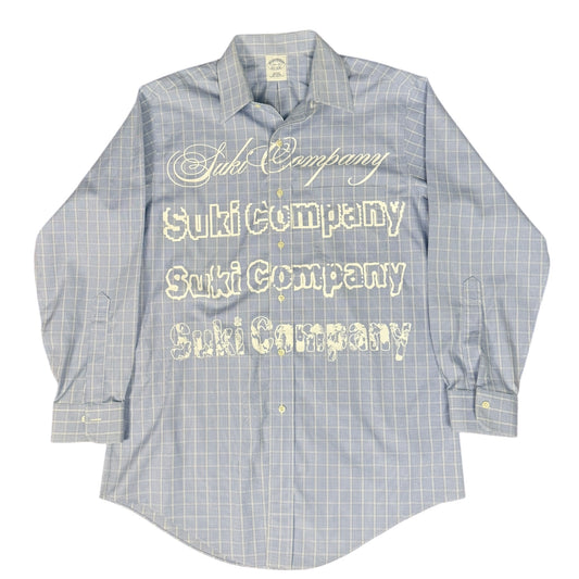 CAMISA MANGA LARGA SUKI AZUL CLARO CUADROS LETRAS BLANCAS TALLA L SK217