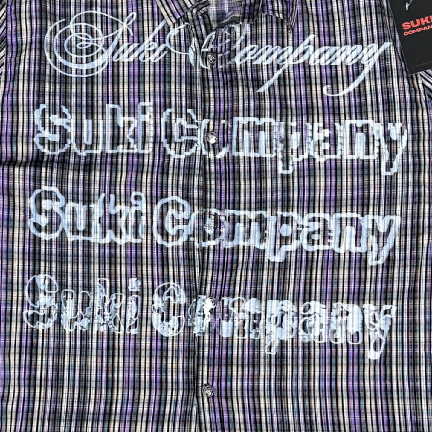 CAMISA MANGA LARGA SUKI MORADA CUADROS LETRAS BLANCAS TALLA L SK211